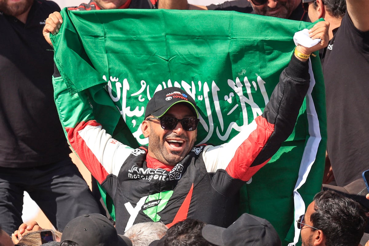 Yazeed Al Rajhi celebrates after winning the Dakar Rally 2025 in the car category.