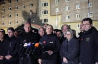Turkish Interior Minister Ali Yerlikaya (C) speaks to the media outside a hotel where a fire broke out in the Kartalkaya Ski Resort in Bolu, northwestern Turkey, on 21 January 2025. A huge fire killed at least 76 people Tuesday as it ripped through a hotel at a popular ski resort in northern Turkey that was packed with people enjoying the winter holidays, including families.