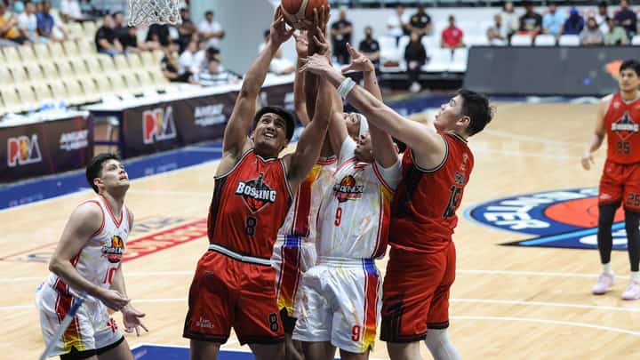 Cliff Jopia of Blackwater (No. 8) fights for the rebound during their PBA Commissioner’s Cup game against Phoenix Super LPG at the Ynares Center last night. The Bossing prevailed, 100-92.