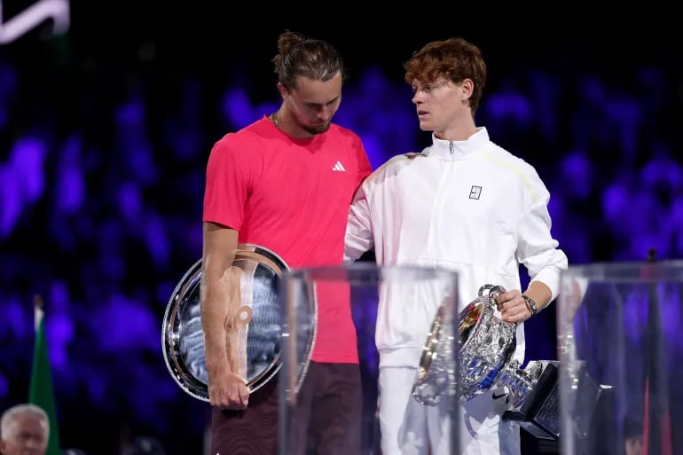 Jannik Sinner and Alexander Zverev pose for pictures after their match