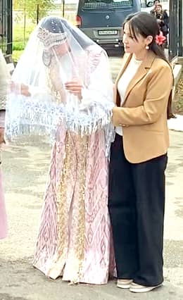 The bride welcoming the guests