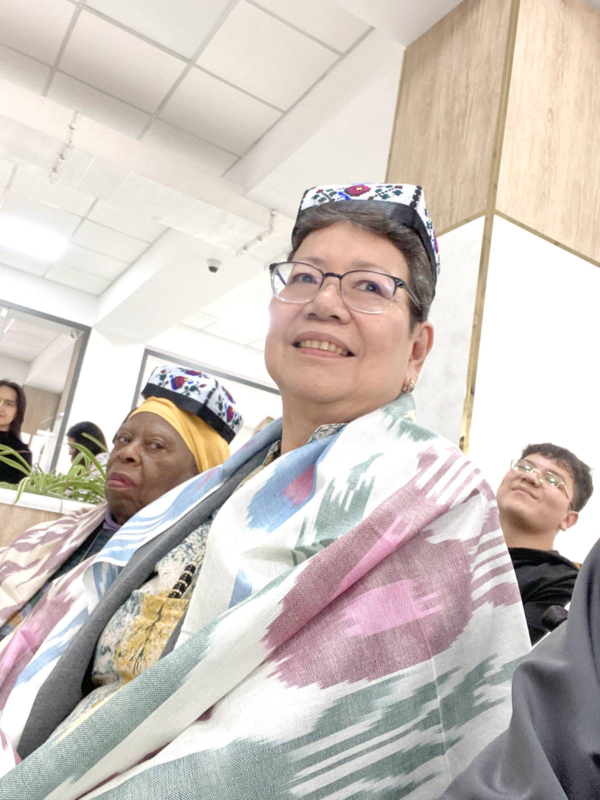The author with traditional hat and shawl with pomegranate prints