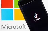 In this photo illustration, a mobile phone featuring the TikTok app is displayed next to the Microsoft logo on August 03, 2020 in New York City. Under threat of a U.S. ban on the popular social media app, it has been reported that Microsoft is considering taking over from Chinese firm ByteDance. (Photo Illustration by Cindy Ord/Getty Images)
Cindy Ord / GETTY IMAGES NORTH AMERICA / Getty Images via AFP