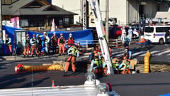 Japan trucker still stuck in sinkhole after 24 hours