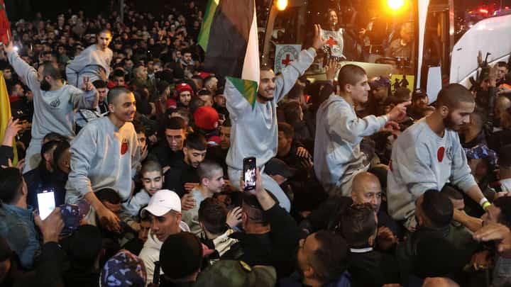 CROWD cheers Palestinians formerly jailed by Israel as they arrive by buses in a Red Cross convoy to Ramallah in the occupied West Bank on 30 January 2025.