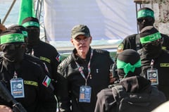Hamas stages Gaza beach handover as Israeli hostages freed