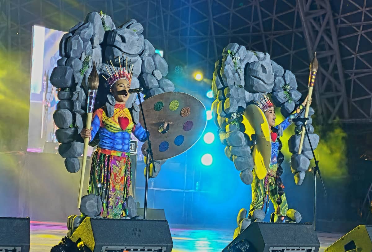 The festival king and queen of Luna wearing costumes promoting their Bato Art Festival.