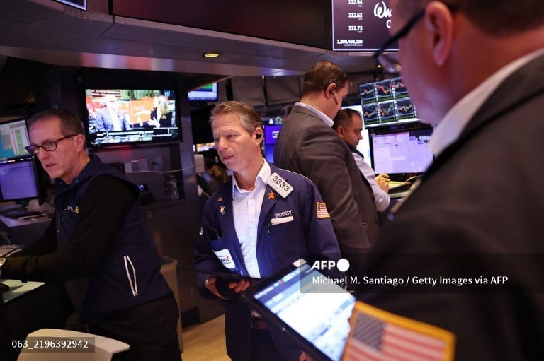 Stock markets sink, dollar rallies as Trump imposes tariffs