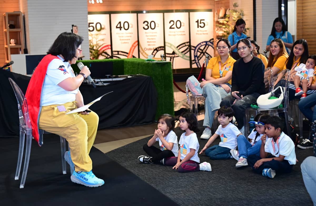 The audience is enthralled as author Bambi Rodriguez reads from her latest work.