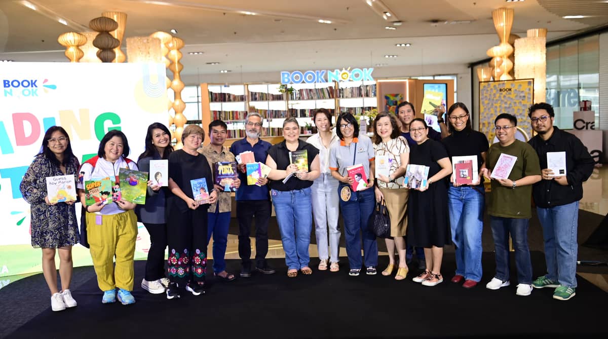 Authors and publishers, with SM Book Nook pioneer Shereen Sy (8th from right), unite to donate books at the SM Book Nook Reading Festival, promoting a love of reading.