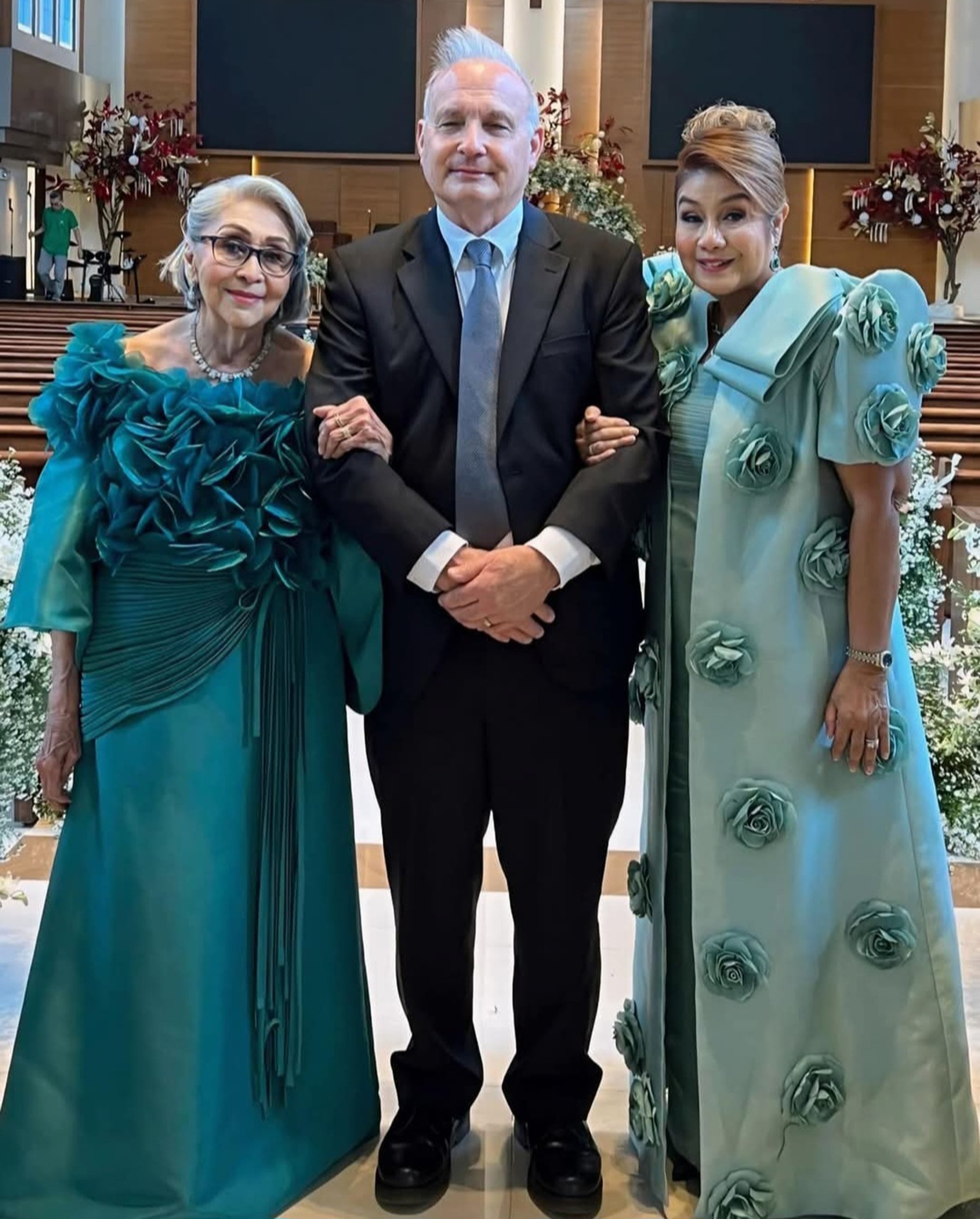 Carmencita Lade, grandmother of the bride, with Brad and Therese Marvel.