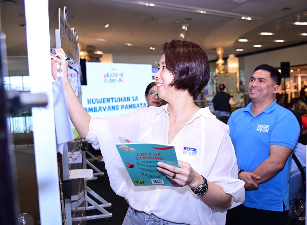 The "Pass the Plot" board at the SM Book Nook Reading Festival ignites collaborative storytelling, inviting participants to build a narrative sentence by sentence.