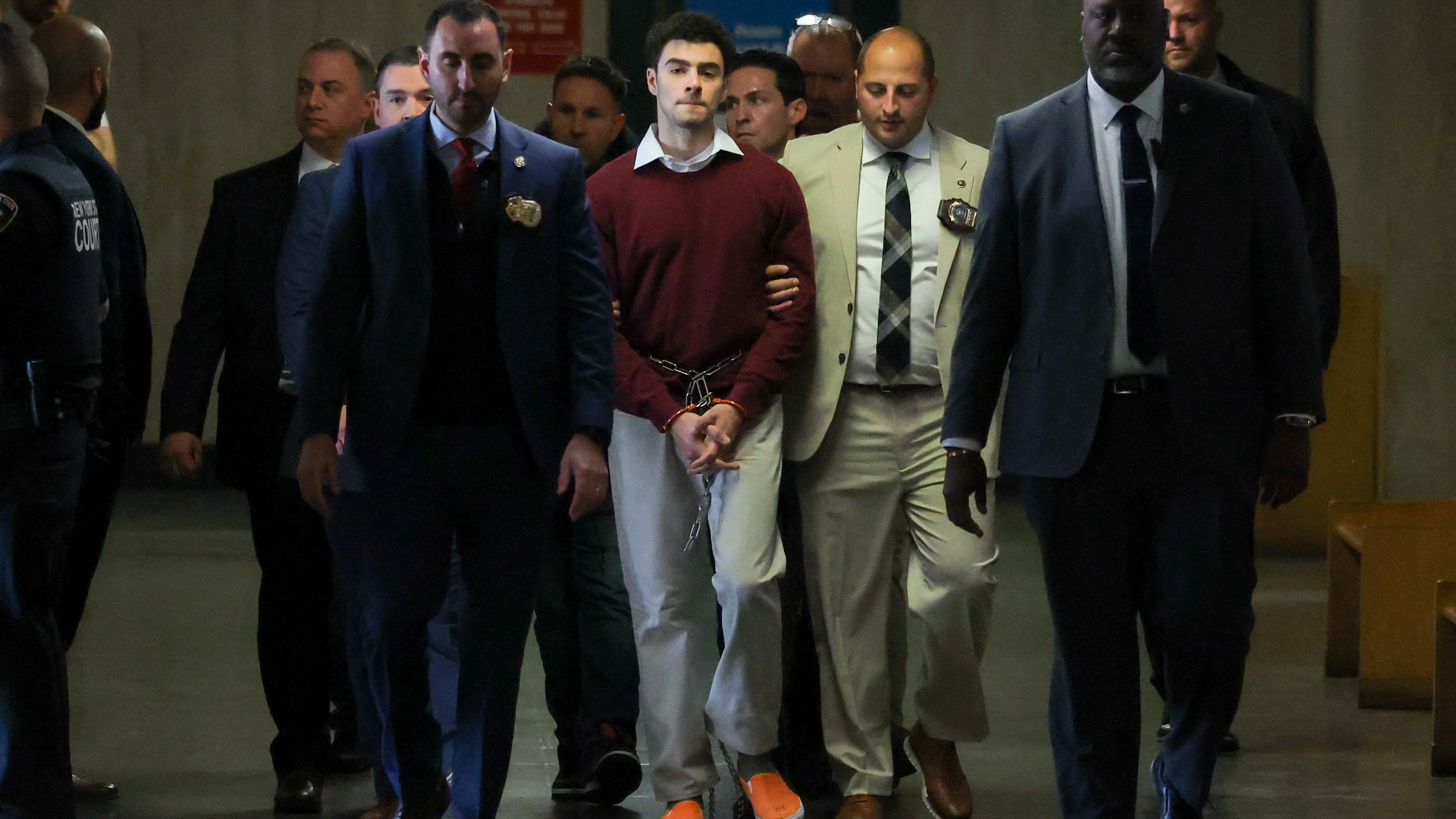 Luigi Nicholas Mangione (C) arrives at Manhattan Criminal Court in New York on 23 December 2024. Mangione, 26, has been accused of shooting UnitedHealthcare chief executive Brian Thompson on a Manhattan street on 4 December.
