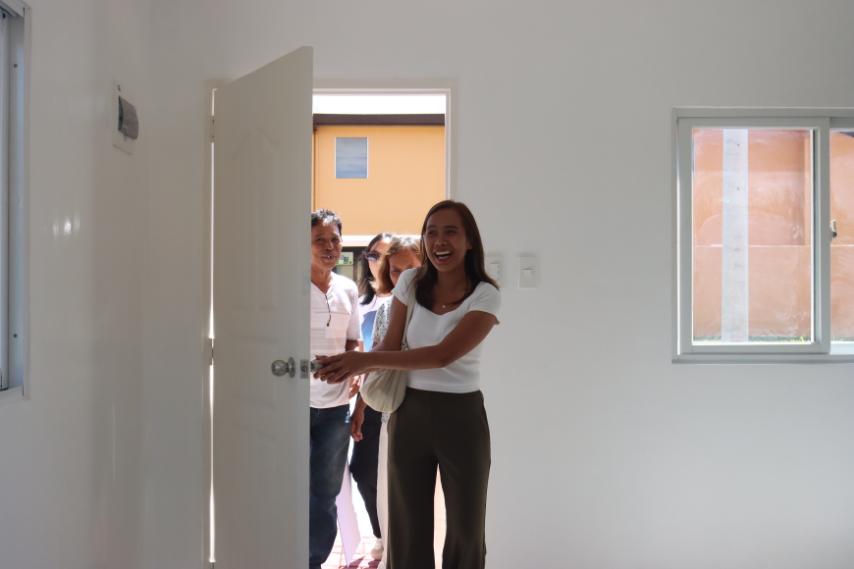 New beginning. Angelica walks into her new Camella home, surrounded by her proud and grateful family, as they embrace this life-changing blessing with excitement and joy.