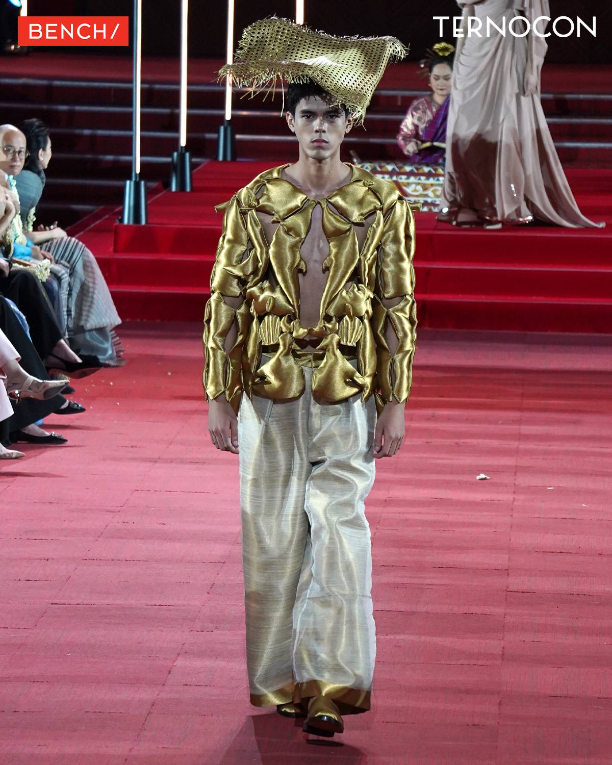 Menswear pieces featured gold, puffy jackets resembling metal armor.