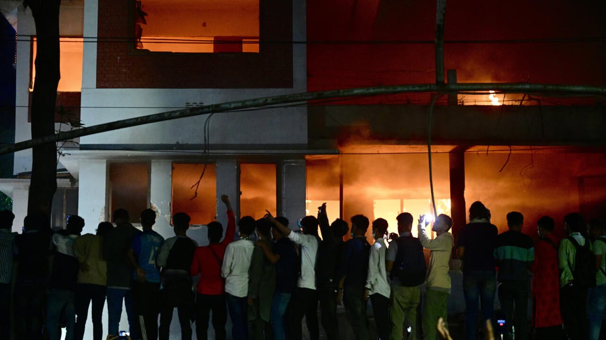 Bangladesh protesters raze buildings linked to ousted leader