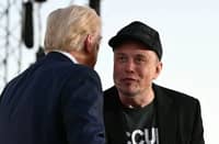 US government 'efficiency czar' Elon Musk (R), pictured with US President Donald Trump, has urged workers to take the resignation deal.