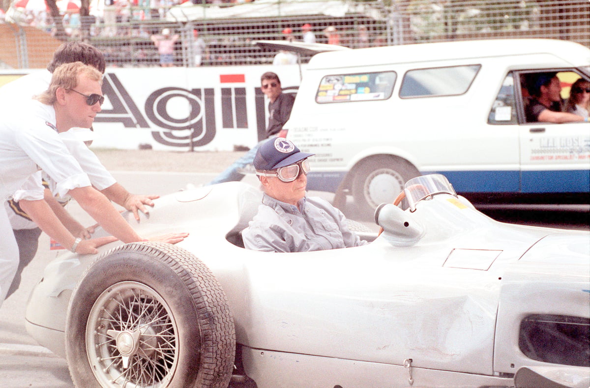 FIVE-TIME Formula One champion Juan Manuel Fangio from Argentina is helped by officials after he lost control of his 1954 Mercedes W196.