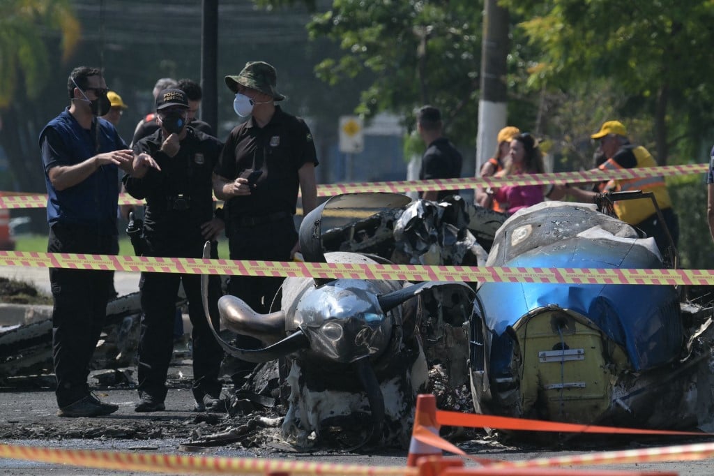 2 dead after small plane crashes in Sao Paulo street, hits bus