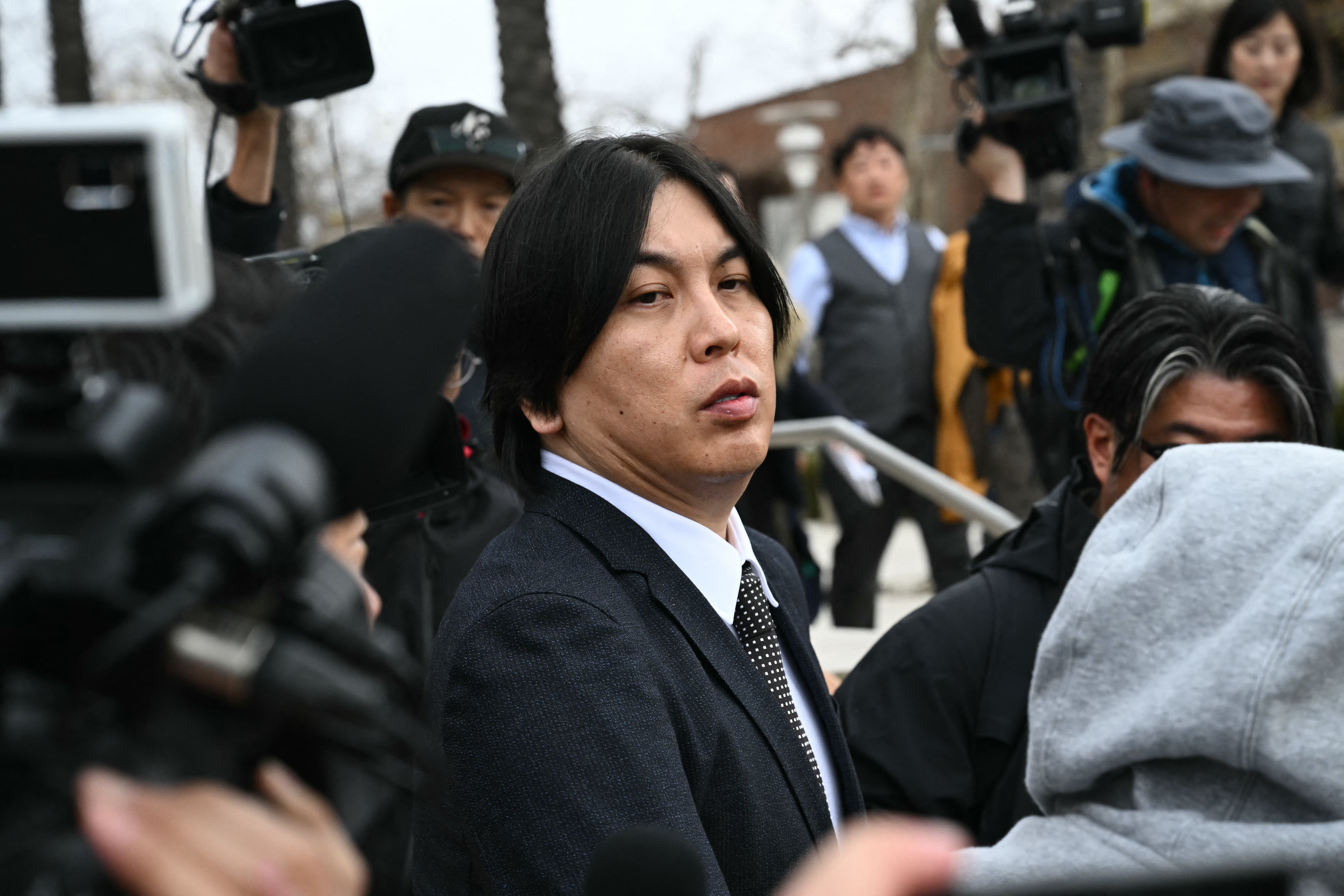 Ippei Mizuhara leaves the Ronald Reagan Federal Building and Courthouse in Santa Ana, California, on February 6, 2025. The former interpreter to Shohei Ohtani, who admitted stealing almost $17 million from the Japanese baseball star to pay off illegal gambling debts, was sentenced to 57 months in prison on February 6. Mizuhara was also ordered to pay restitution of more than $18.1 million in his sentencing in federal court.