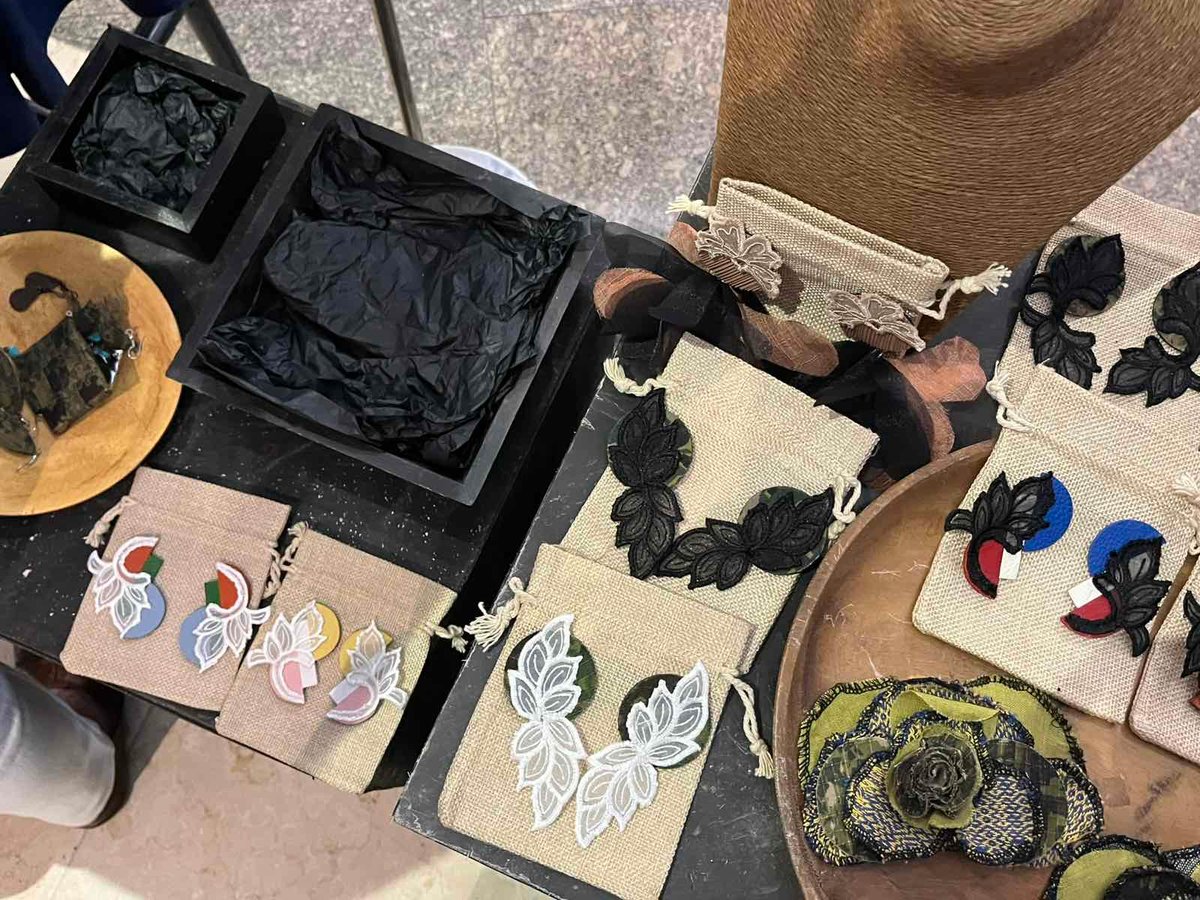 Accessories crafted from excess materials showcased at the event.