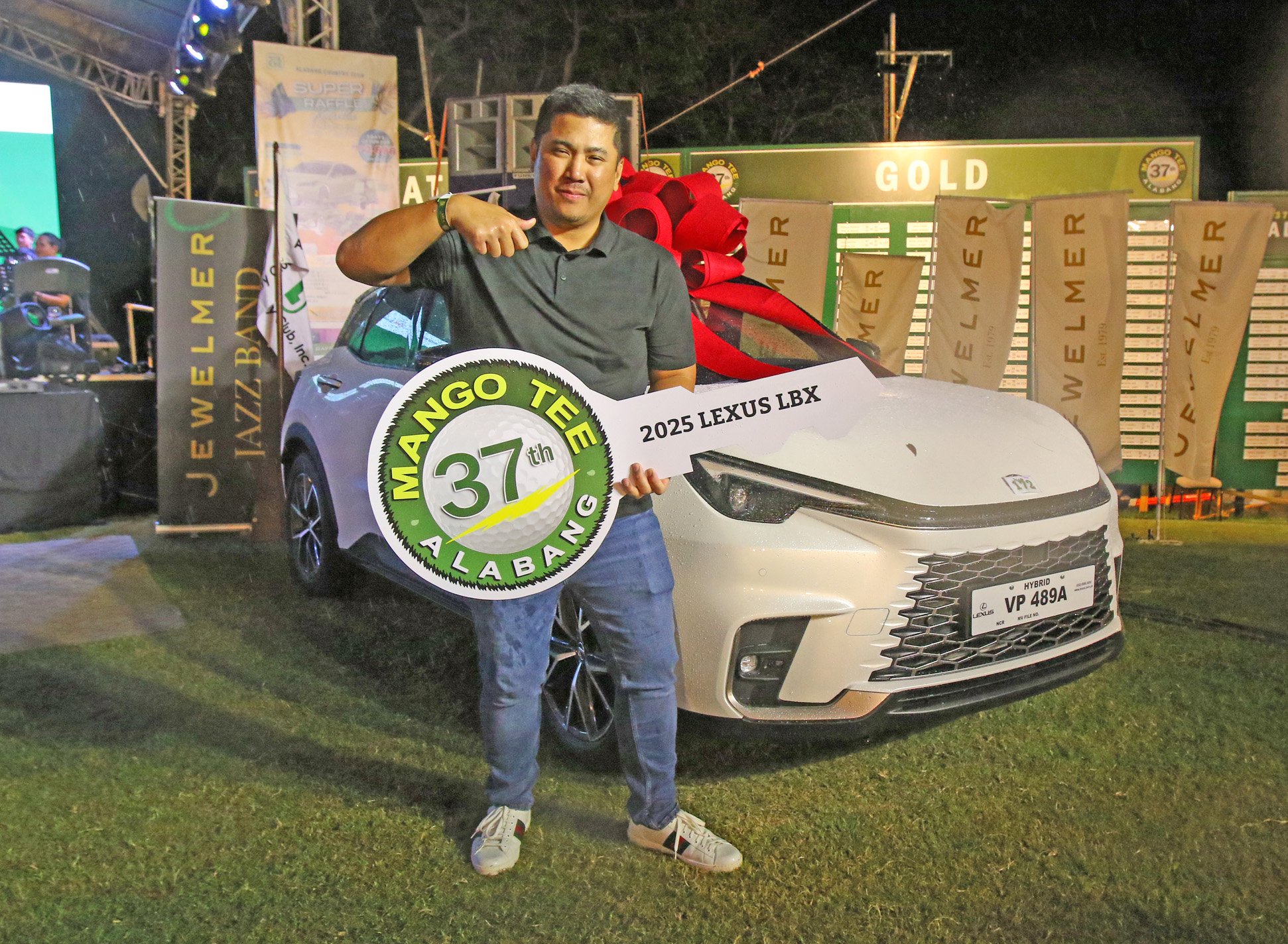 SANTI Rojas gets to drive home a brand-new 2025 Lexus LBX after hitting the major prize in the raffle draw during the 37th Mango Tee Invitational late Saturday at the Alabang Country Club.