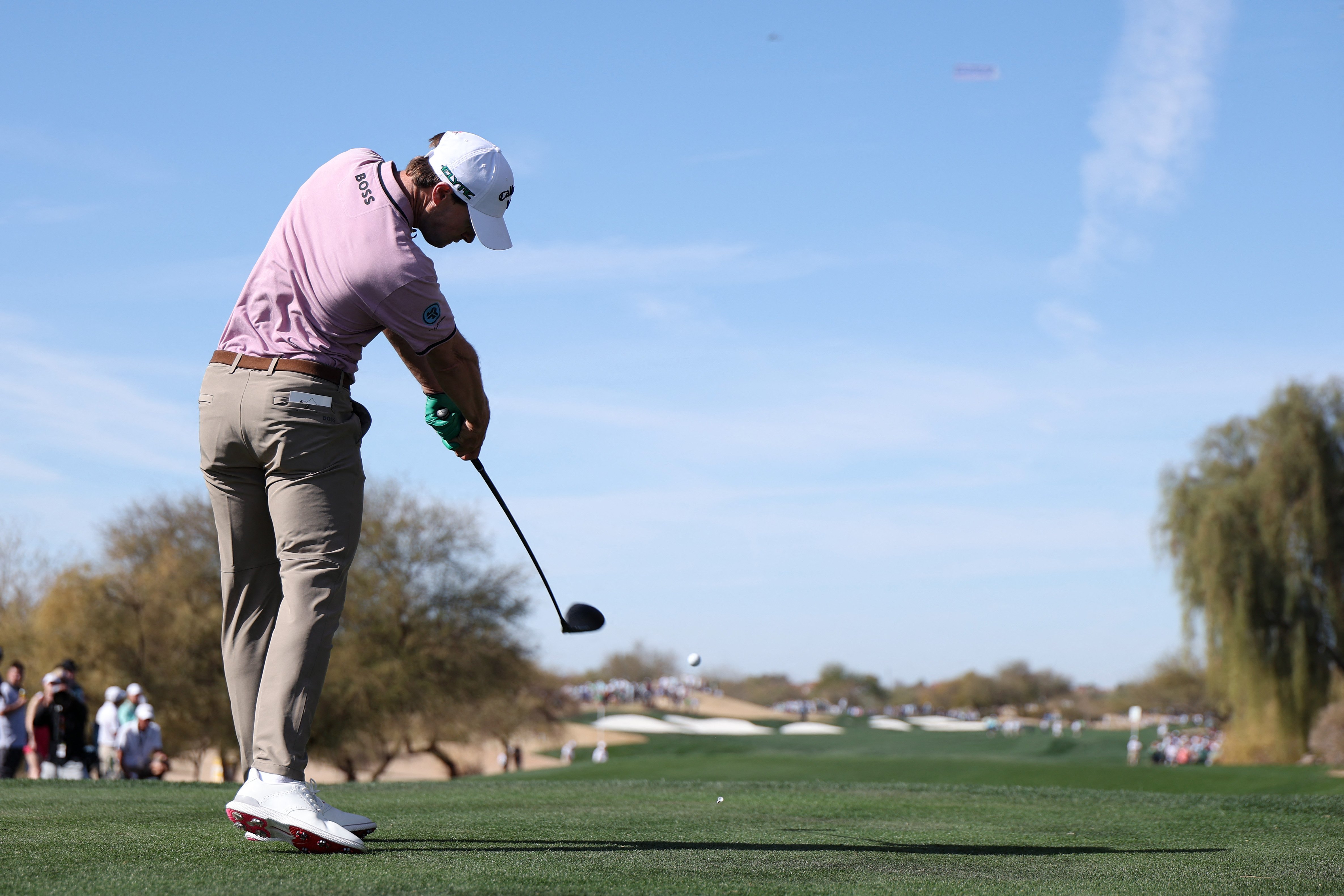 Detry shoots 65, widens lead