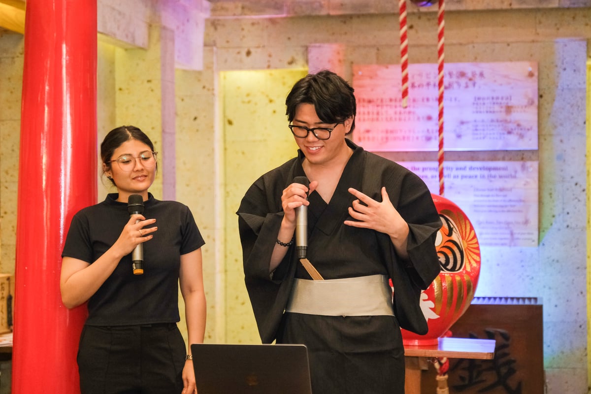 Tsuguto Yamada (left), Kabuki Creatives CEO with a translator.
