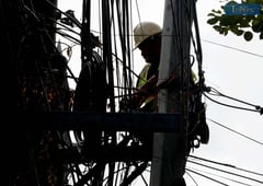 Meralco contractor repairs wires amid power interruptions in Metro Manila, Calabarzon