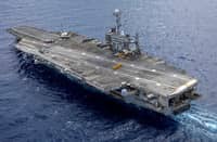 In this handout image provided by the US NAVY the Nimitz-class aircraft carrier USS Harry S. Truman (CVN 75) transits the Atlantic Ocean during an ordnance transfer, 24 August 2024.