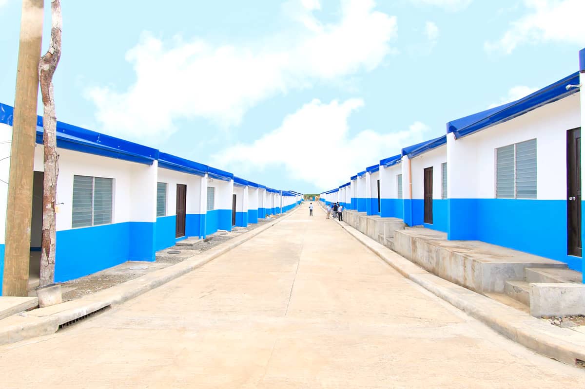 Blue roof houses. One of NHA’s landmark programs is to build homes that are disaster-resistant and energy-efficient by 2028.