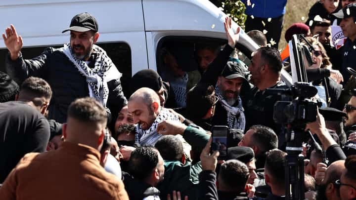 Released Palestinian prisoners are greeted by friends and relatives upon their arrival in the occupied West Bank city of Ramallah on February 15, 2025.
