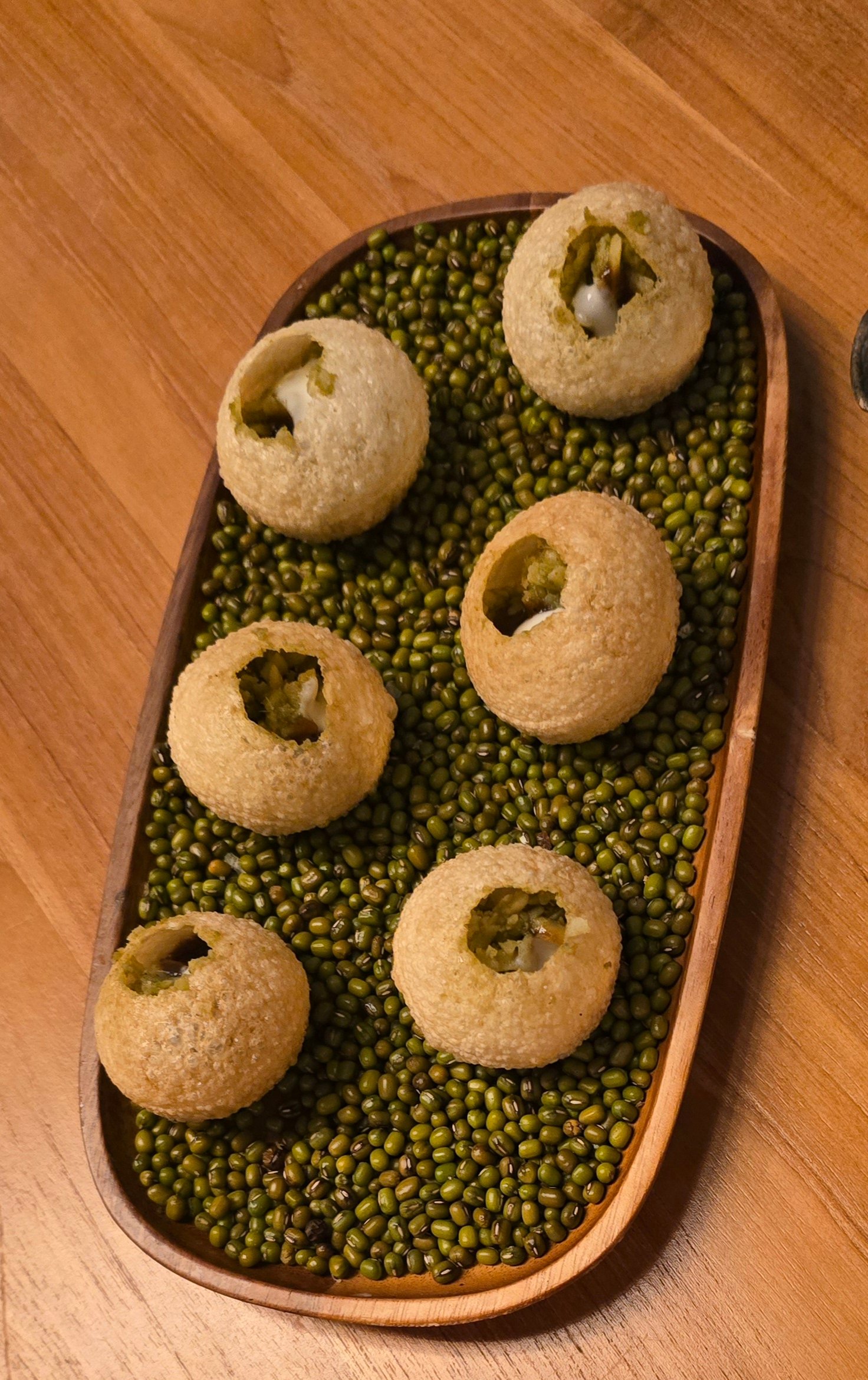 Amuse-bouche -Panipuri blend of mashed potatoes, chickpeas and a medley of spices.