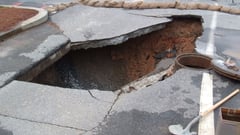 Villagers in shock after sinkhole engulfs British street