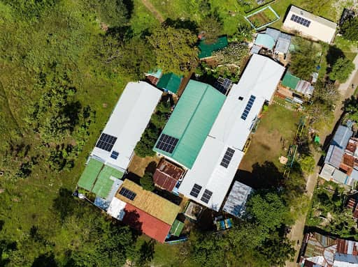 Solar panels installed at Pangan-an Elementary and High School provide reliable renewable energy, reducing costs and supporting better educational resources.