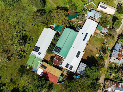 Solar panels installed at Pangan-an Elementary and High School provide reliable renewable energy, reducing costs and supporting better educational resources.
