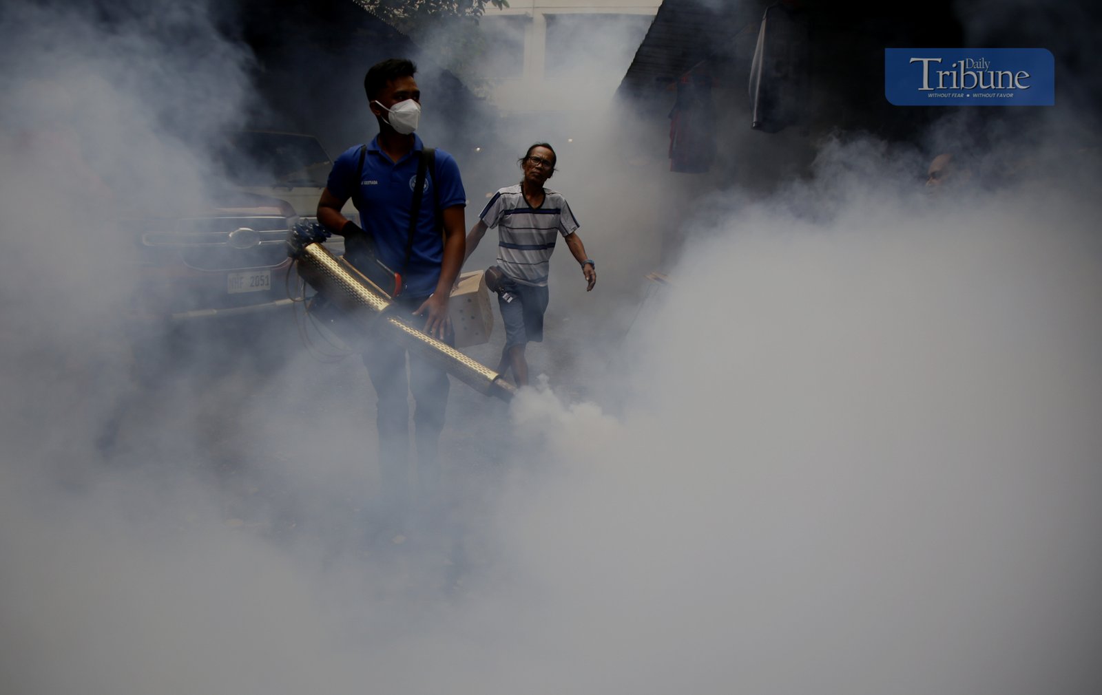 Manila City's Disaster Risk Reduction Office conducts fogging operations in Barangay 390 on 20 February 2025 as dengue cases rise, with Quezon City declaring an outbreak.