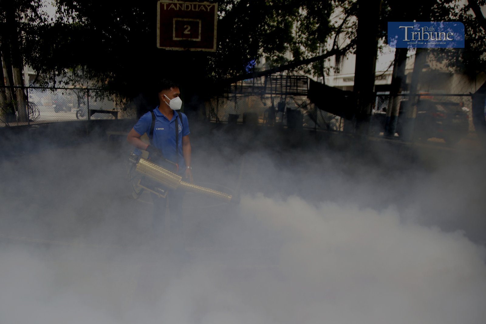 Manila City's Disaster Risk Reduction Office conducts fogging operations in Barangay 390 on 20 February 2025 as dengue cases rise, with Quezon City declaring an outbreak.
