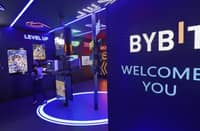Visitors stand in front of works by Bybit on display during the 15th edition of Art Dubai at Madinat Jumeirah in the Gulf emirate of Dubai, on 10 March 2022.