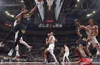 Craig Porter #9 of the Cleveland Cavaliers drives to the basket during the game against the New York Knicks on 21 February 2025 at Rocket Arena in Cleveland, Ohio.
