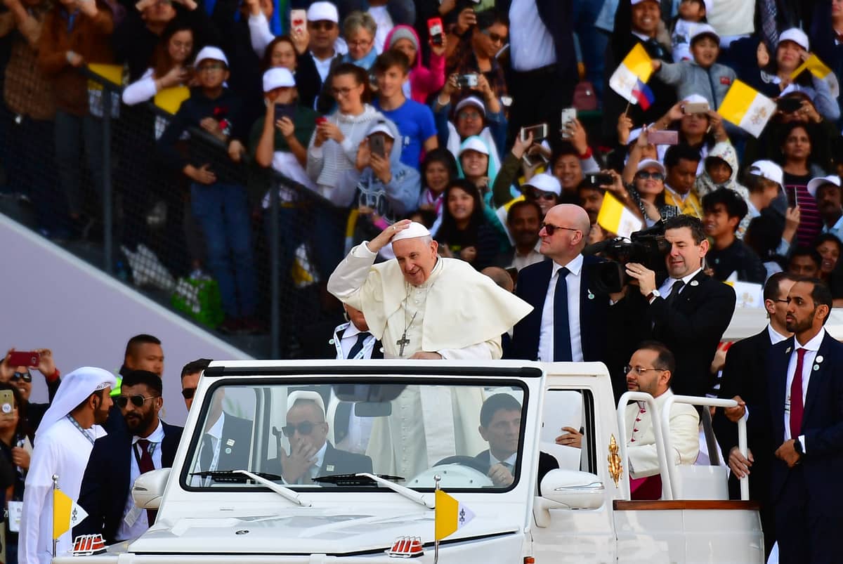Pope Francis waves to the crowd as he arrives to lead mass for an estimated 170,000 Catholics at the Zayed Sports City Stadium on 5 February 2019.
