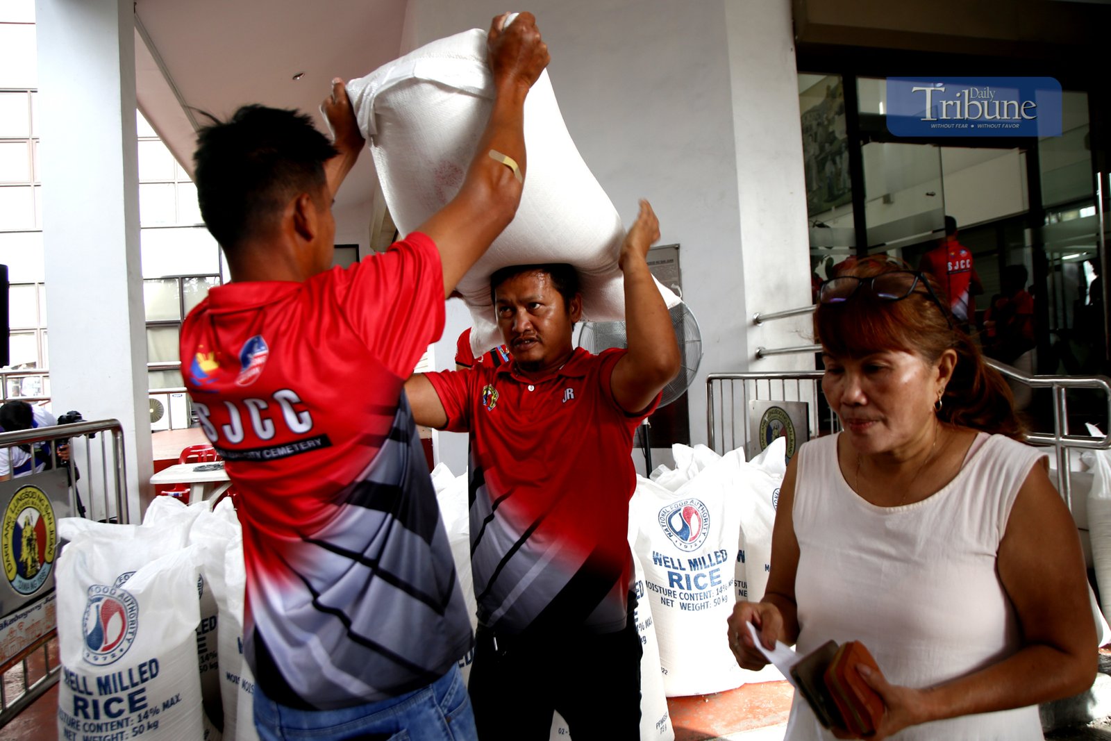 The local government of San Juan City sells NFA rice at the city hall driveway on 24 February 2025. A 50-kilo sack is priced at P1,650 as part of the Department of Agriculture's Food Security Emergency.