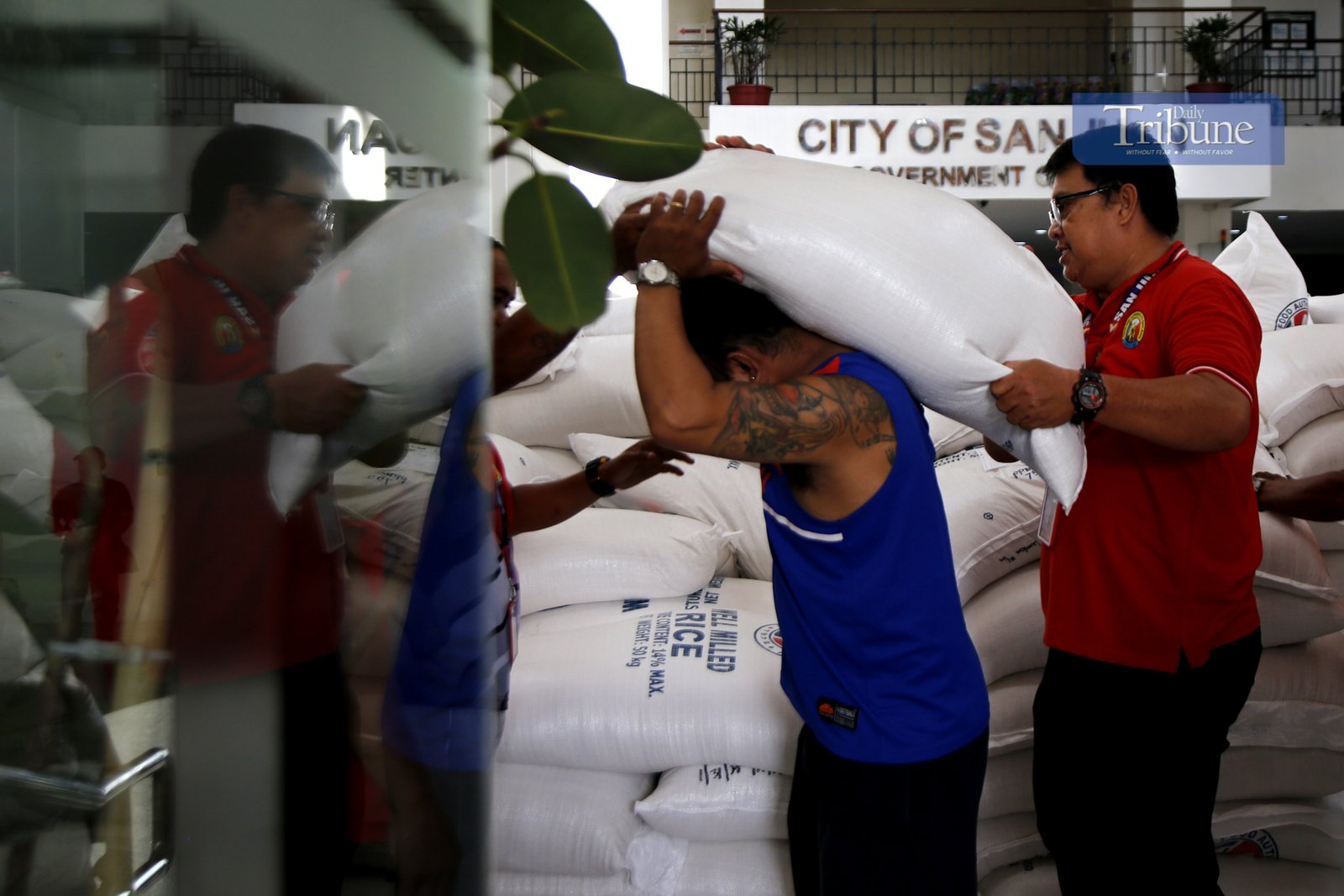 The local government of San Juan City sells NFA rice at the city hall driveway on 24 February 2025. A 50-kilo sack is priced at P1,650 as part of the Department of Agriculture's Food Security Emergency.