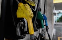 A GASOLINE attendant, his movements swift and focused, fills the tank of a truck in Quezon City on Tuesday. The steady rise in fuel prices casts a heavy shadow over the routine task, as the cost climbs with each click of the nozzle, adding to the mounting financial strain felt across the city.