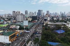 Light to moderate traffic is seen along EDSA Cubao in Quezon City on Thursday afternoon.