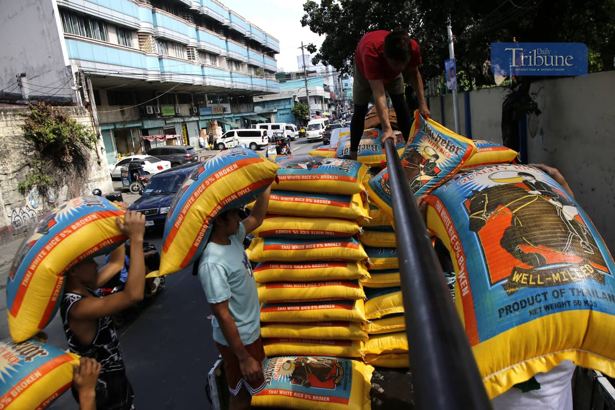 On 28 February 2025, workers loaded sacks of imported rice onto a truck in Tondo, Manila, as the Department of Agriculture announced a reduction in the maximum suggested retail price to P49 per kilo, effective 1 March.