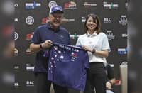 Puerto Princesa Mayor Lucilo Bayron (left) receives the IRONMAN 70.3 Puerto Princesa finisher’s shirt from LGR Sportswear COO Eunice Galura during the press launch of the third IRONMAN 70.3 Puerto Princesa that is on Sunday.