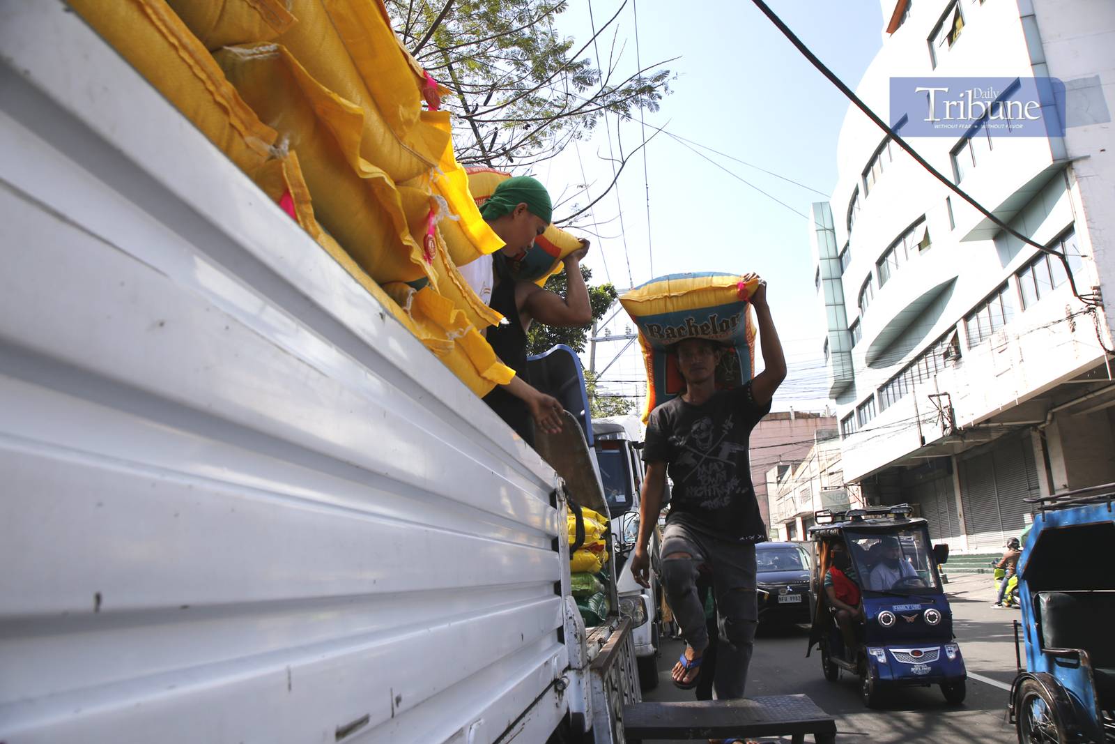On 28 February 2025, workers loaded sacks of imported rice onto a truck in Tondo, Manila, as the Department of Agriculture announced a reduction in the maximum suggested retail price to P49 per kilo, effective 1 March.