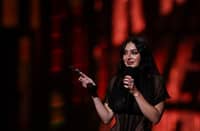 British singer Charli XCX celebrates on stage after receiving the award for Song of the year during the BRIT Awards 2025 in London on 1 March 2025.