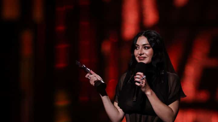 British singer Charli XCX celebrates on stage after receiving the award for Song of the year during the BRIT Awards 2025 in London on 1 March 2025.